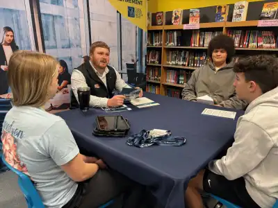Group of young adults sitting at a table